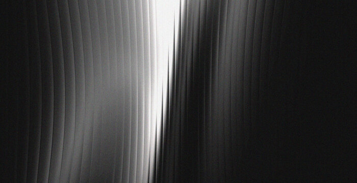 Dark Black and White Fluted Glass Texture Background with Curved Vertical Lines and Center Light
