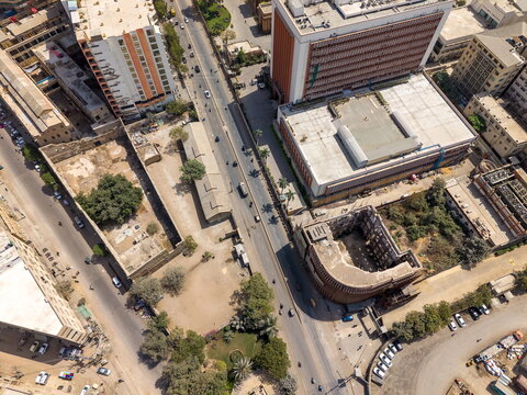 Aerial view of I.I. Chundrigar Road featuring dense urban architecture, office buildings, and traffic flow on the main thoroughfare in Karachi, Sindh, Pakistan.