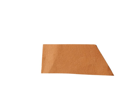A single piece of brown cork material shaped like a trapezoid for office or craft project use isolated on transparent background