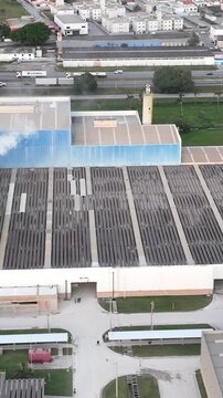Industrial Data center in Santa Catarina, Brazil. Aerial view in vertical video. Production of porcelain tiles and large format porcelain slabs.