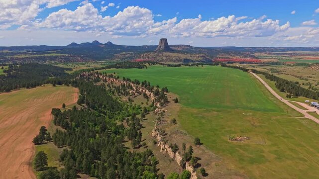 Panoramic aerial view of Devils Tower National Monument rising above the surrounding landscape in Wyoming