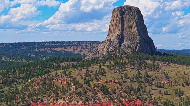 Panoramic aerial view of Devils Tower National Monument rising above the surrounding landscape in Wyoming
