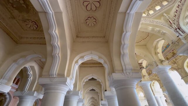 Decorative stone pillars and ornate architectural details inside Thirumalai Nayakkar Palace in Madurai, Tamil Nadu, India, showcasing the grandeur and craftsmanship of Nayak dynasty heritage