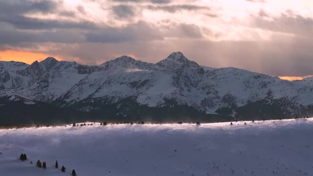 Mount of the Holy Cross 14er cross of snow aerial drone winter sunset Vail PassEagle County backcountry Sawatch Range Colorado Rockies snow-covered peak glades nature landmark landscape circle right