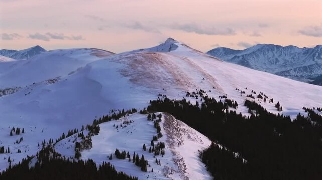 Winter sunset Colorado Rockies nature landscape snow-covered rugged Rocky Mountain peaks aerial drone Colorado Vail Pass wind slab avalanche cornice backcountry ski terrain Ptarmigan Hill circle right