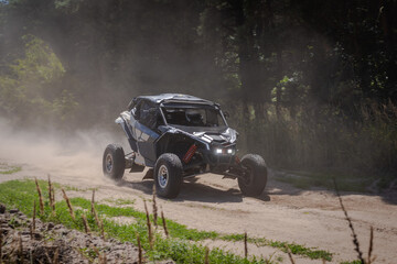 UTV buggy, 4x4 competition on dusty road. Rally, extreme, adrenalin © Antonio
