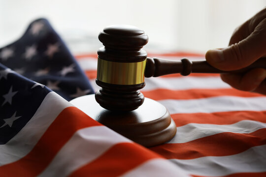 Judge's gavel on the table in focus. Cropped view of Judge's hammer for attention and verdict, justice judgment at courts of law.