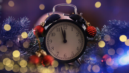 Christmas gifts, fir branches and alarm clock on wooden table. Boxing day