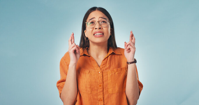 Results, worry or woman with fingers crossed, hope expression or wish for good luck. Expectation, space or female person on studio background with gesture, nervous or waiting for positive outcome.