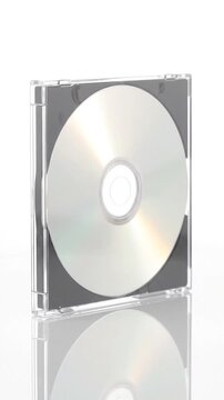 Compact disc in a clear plastic case on white background