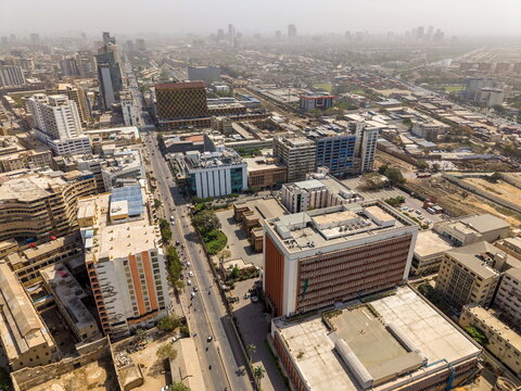Aerial view of I.I. Chundrigar Road featuring dense urban architecture, high-rise office buildings, and busy streets in Karachi, Sindh, Pakistan.