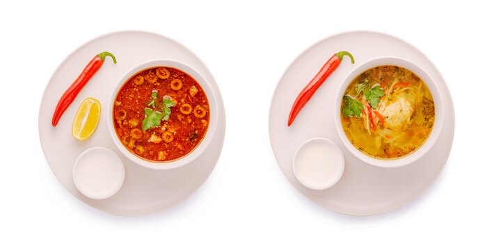 Traditional ukrainian solyanka and chicken noodle soup plates