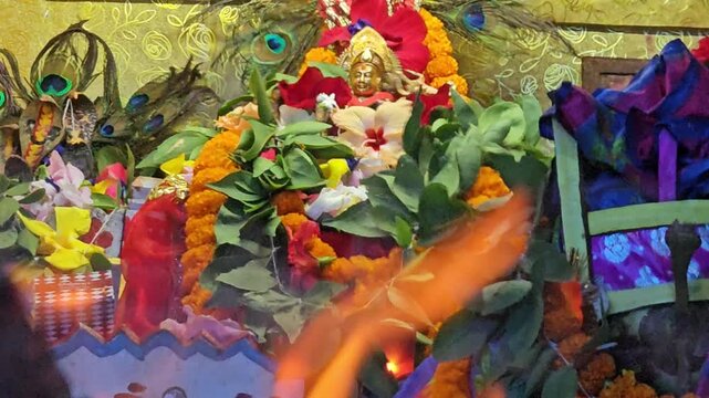 Sacred Hindu Havan Homam Yajna fire ritual being performed during a religious puja ceremony in India. The holy fire burns brightly in a traditional fire altar while devotees offer prayers