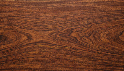 Fototapeta premium Rich dark wood texture featuring intricate grain patterns and flowing organic lines. Deep brown tones create a warm, elegant background with natural character and depth.