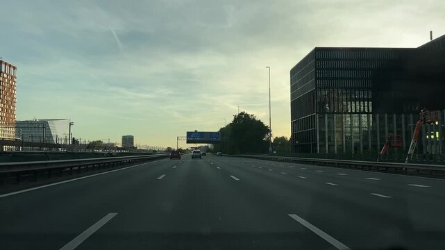 Amsterdam Netherlands highway, Evening highway through modern city district