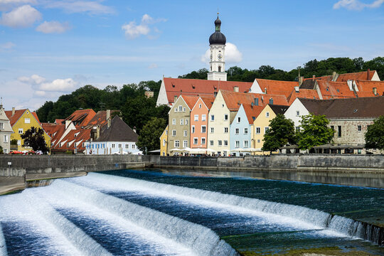 View of the historic town of Landsberg am Lech with its colorful buildings and the Lech river weir in the foreground, Landsberg am Lech, Bavaria, Germany.