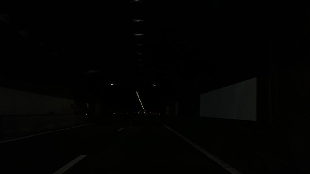 Amsterdam Netherlands highway, Car driving through a dark tunnel on an urban roadway