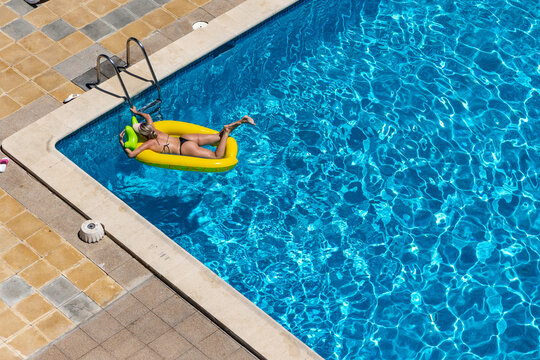 A girl swims in a pool at a hotel in Palma de Mallorca, Spain.