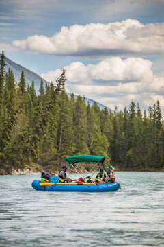 Group of people rafting on a remote mountain river