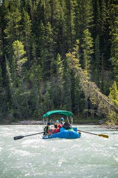 People enjoying a scenic whitewater rafting trip