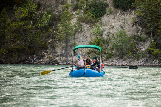 Group of friends floating down a mountain river