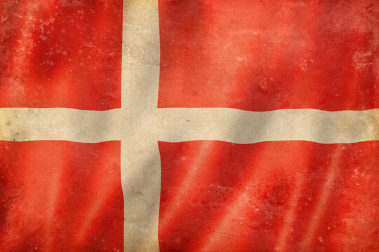 Old vintage flag of Denmark, worn and stained
