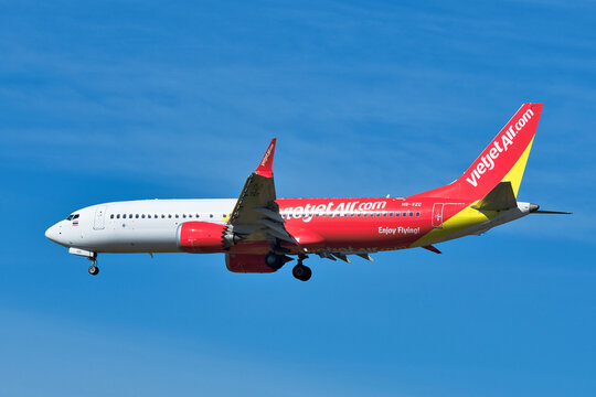 VietJet Air Boeing 737 MAX 8 (HS-VZC) passenger plane approaching Narita International Airport for landing under clear blue sky