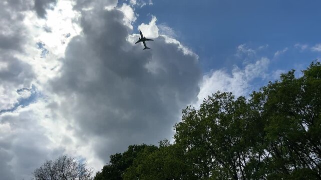 Aircraft flying over Amsterdam Forest park near Schiphol Airport, Netherlands Aircraft flying over Amsterdam Forest