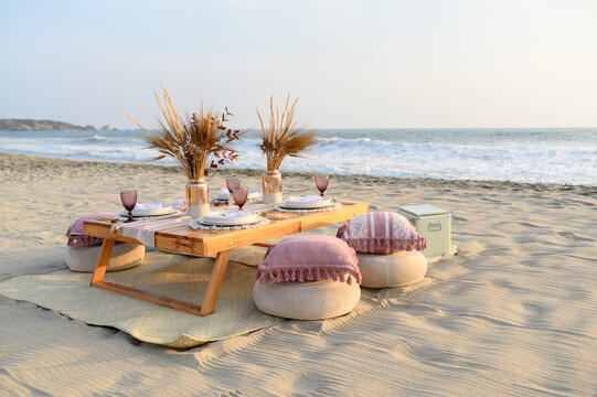 Beach picnic table setup for luxury outdoor dining
