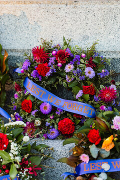 Colourful floral wreaths at memorial on ANZAC day in Australia