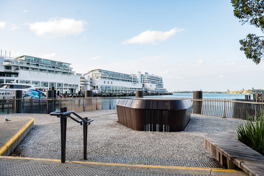 Waterfront pier with ocean view and buildings in the background