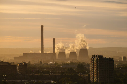 The Sakmara Thermal Power Plant in Orenburg is shrouded in smog from emissions at sunset.