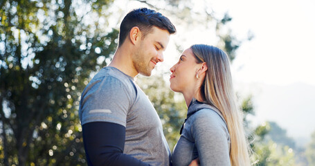 Fototapeta premium Fitness, affection and couple in nature for exercise, bonding and support for morning workout. Happy, love and man with woman for intimacy outdoor in park for sports, active or health together.
