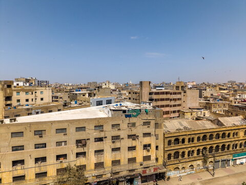 Aerial view of I.I Chundriger Rd featuring dense urban architecture, historic buildings, and commercial rooftops in Karachi, Sindh, Pakistan.