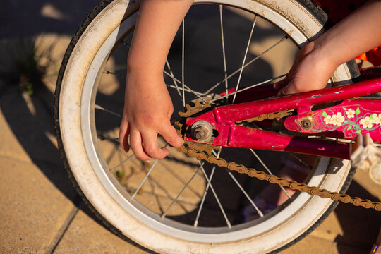 Australian outdoor repair of child&rsquo;s pink bicycle