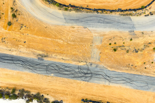 aerial view of tyre burnout marks on kart track