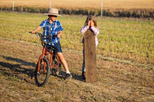 Two children children enjoying countryside games together