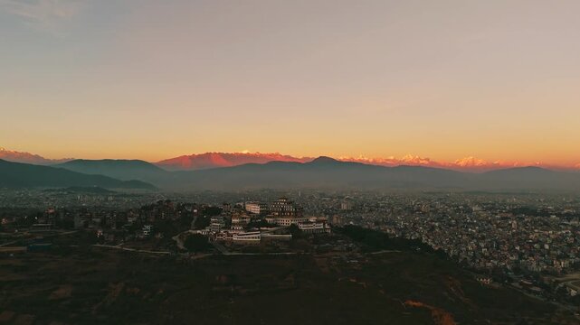 Buddhist Monastery Hilltop Golden Sunset Himalayan Range Kathmandu Nepal Aerial	,  Gumba and Himalayan Range in Single Frame