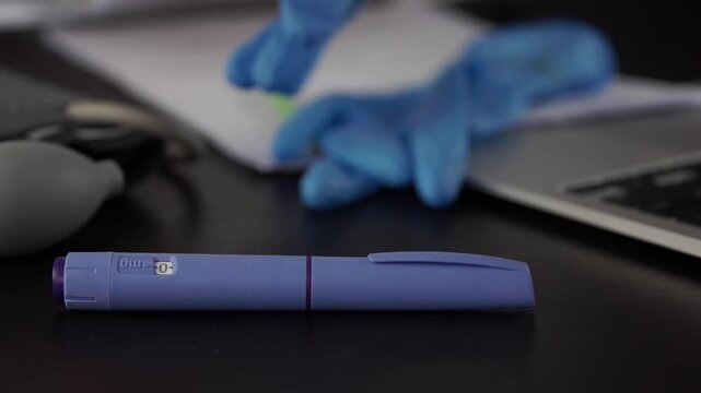 ozempic pen medical injection hand blue gloves desk background, professional preparing diabetes medication for patient treatment, clinical setup, concept of healthcare support and wellness management.