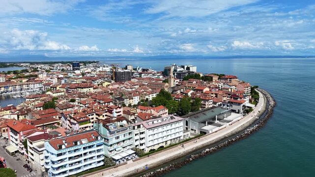 Grado, Italy with coastline, sea, and old town architecture during summer