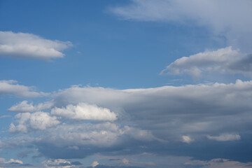 Fototapeta premium Dramatic sky with white and gray clouds