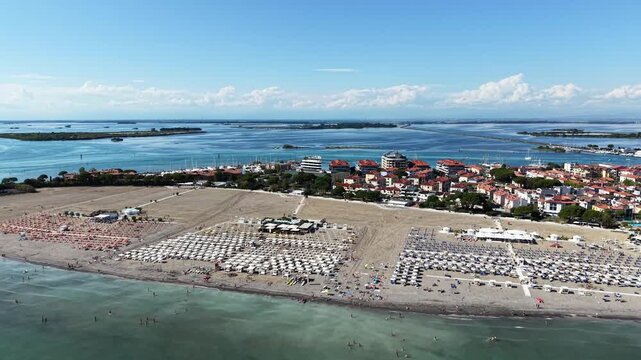 Grado, Italy with coastline, sea, and old town architecture during summer
