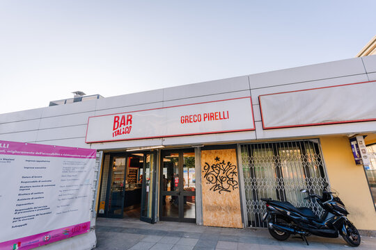 Bar Italico Greco Pirelli storefront with signage and a parked scooter in front, located in an urban setting