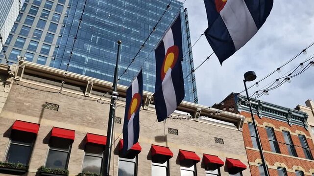 Colorado State Flags and Buildings on Larimer Square in Downtown Denver USA