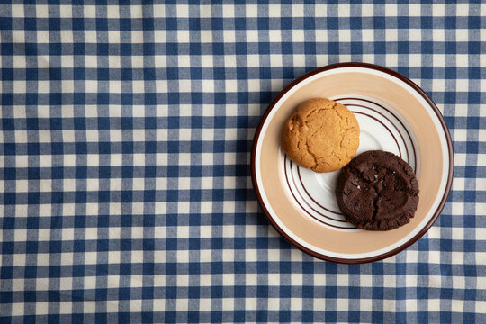 cookies on a blue and white checkered tablecloth