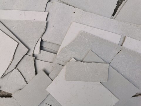 Close up​ of cement board or cement panel offcuts pile abstract background