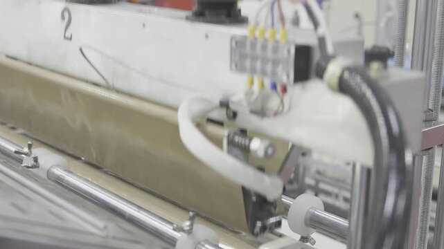 Industry machine working, Plastic bag shopping bag production machine, Factory machine working. Manufacturing system, Industrial automation, Production line.