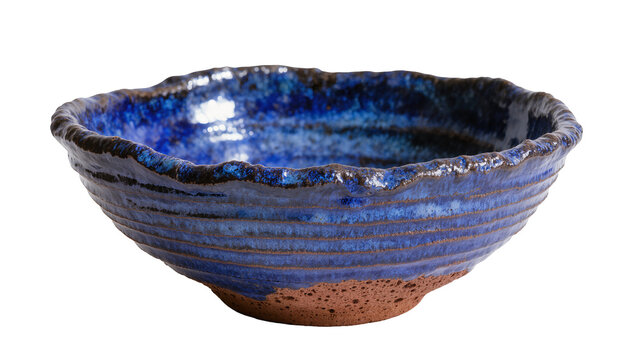 Handcrafted rustic blue ceramic bowl with textured rim, isolated on transparent background