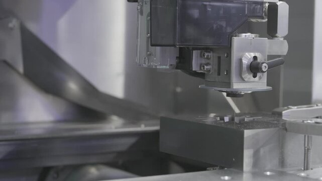 EDM Wire cutting machine working, Closeup Wire Electrical Discharge Machining high precision cut.