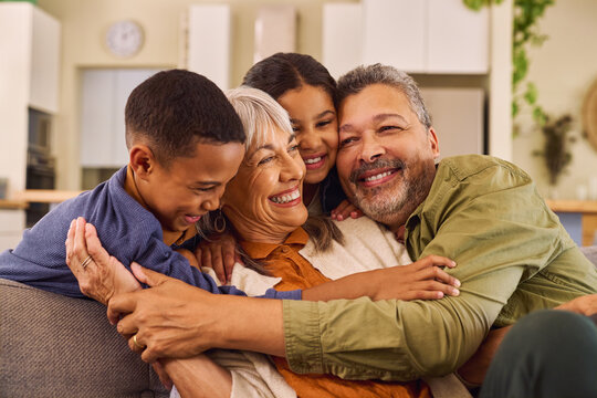 Big hug between lovely grandchildren and multiethnic grandparents